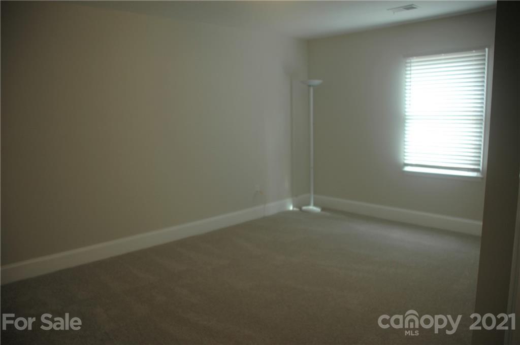521 Gray Drive Charlotte, NC 28213 - Photo 7 of 34 an empty room with a window