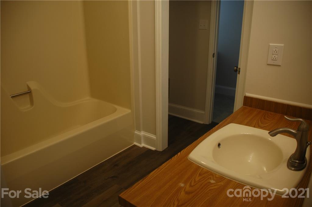 521 Gray Drive Charlotte, NC 28213 - Photo 9 of 34 a bathroom with a tub