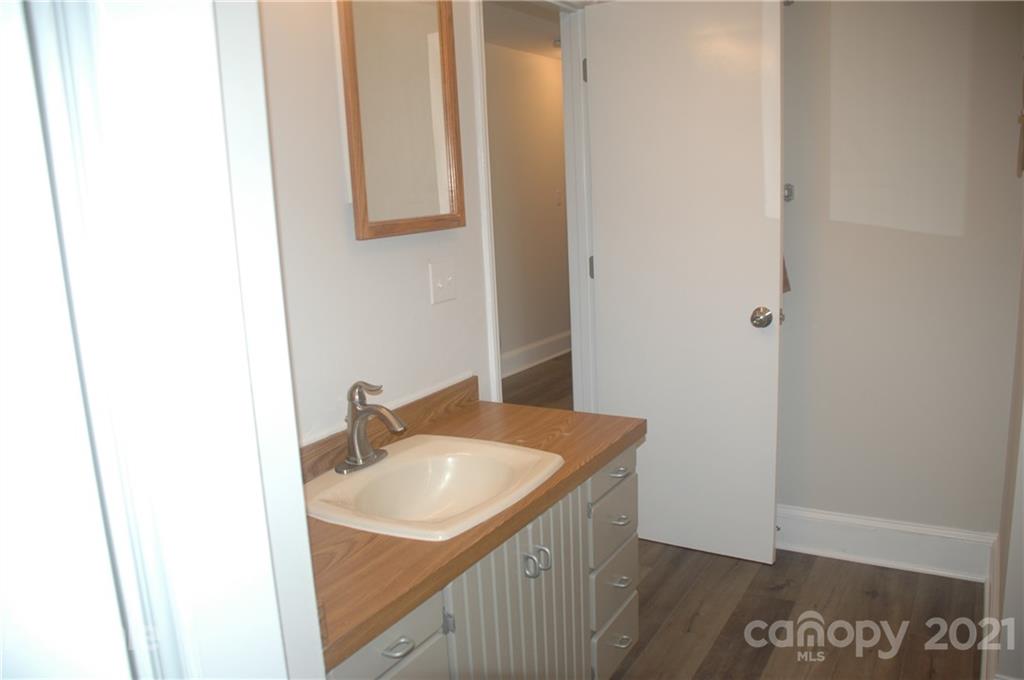 521 Gray Drive Charlotte, NC 28213 - Photo 10 of 34 a bathroom with a sink and a mirror