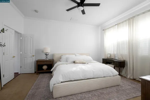 a bedroom with a bed and window