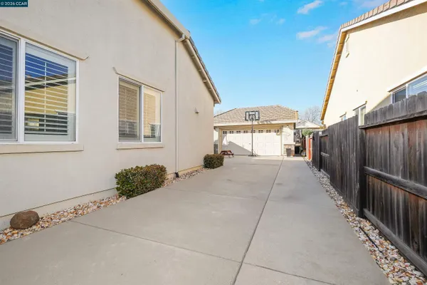 a view of a backyard with sitting area