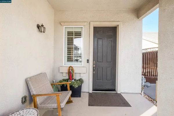a view of a livingroom with furniture and front door
