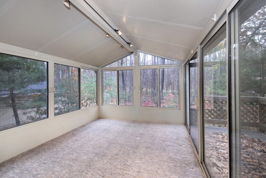 869 Burroughs Road Boxborough, MA 01719 - Photo 11 of 19 a view of empty room with floor to ceiling window