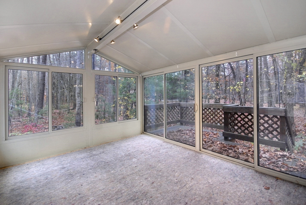 869 Burroughs Road Boxborough, MA 01719 - Photo 12 of 19 a big room with wooden floor and windows