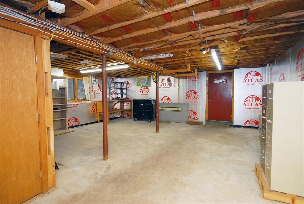 869 Burroughs Road Boxborough, MA 01719 - Photo 14 of 19 a view of a room with a refrigerator and a table
