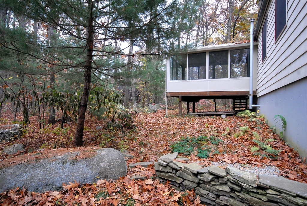 869 Burroughs Road Boxborough, MA 01719 - Photo 16 of 19 a front view of a house with a yard