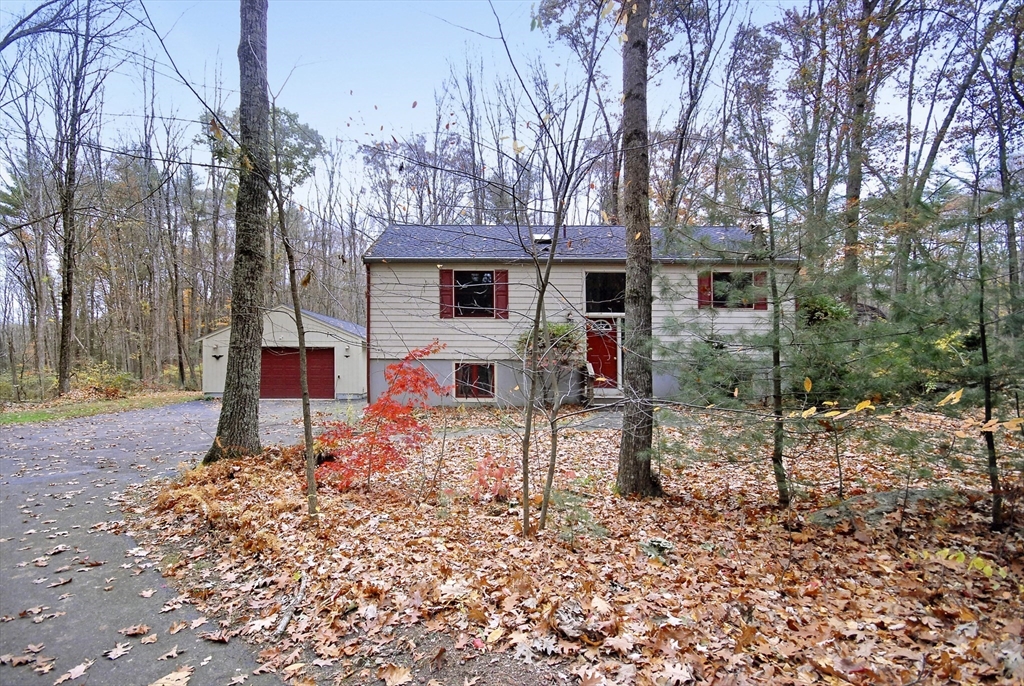 869 Burroughs Road Boxborough, MA 01719 - Photo 2 of 19 a view of a house with backyard and trees
