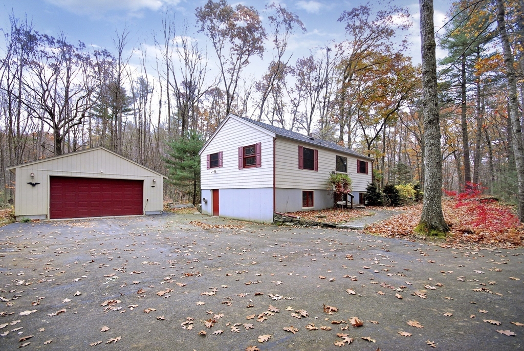 869 Burroughs Road Boxborough, MA 01719 - Photo 4 of 19 a view of a house with a yard