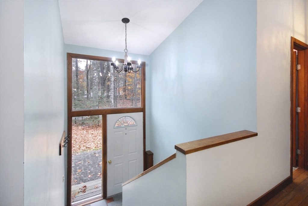 869 Burroughs Road Boxborough, MA 01719 - Photo 5 of 19 a view of a hallway with windows