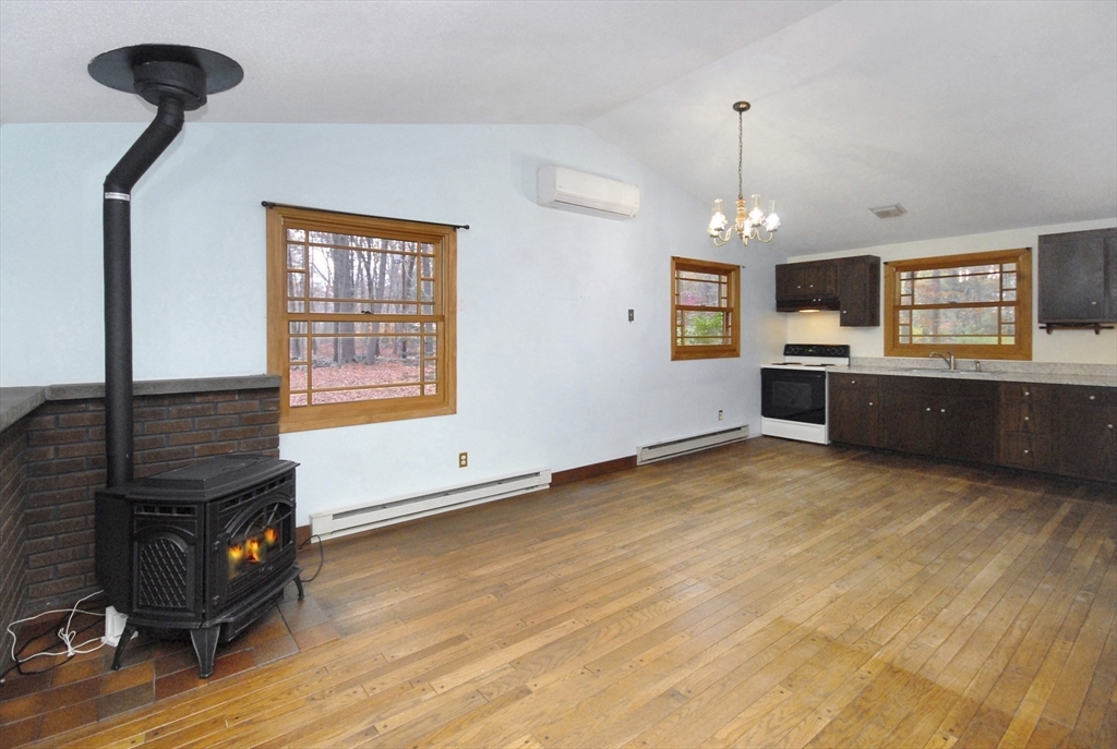 869 Burroughs Road Boxborough, MA 01719 - Photo 10 of 19 a view of a livingroom with furniture wooden floor and window