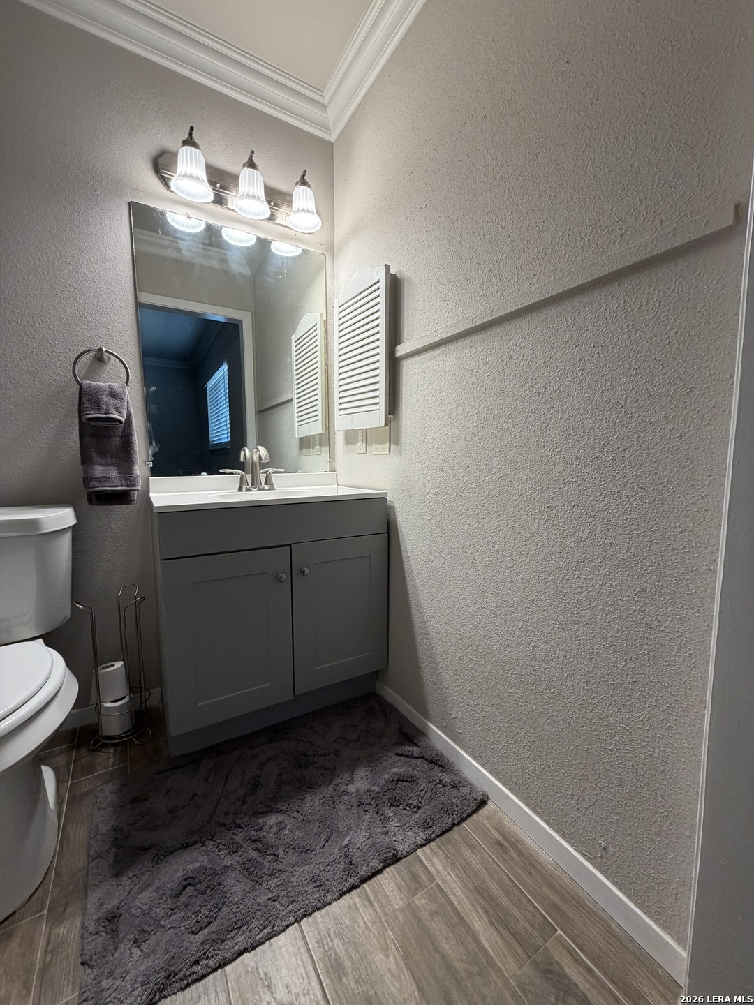 7219 Spring Drops Street San Antonio, TX 78249 - Photo 21 of 37 a bathroom with a sink and a mirror