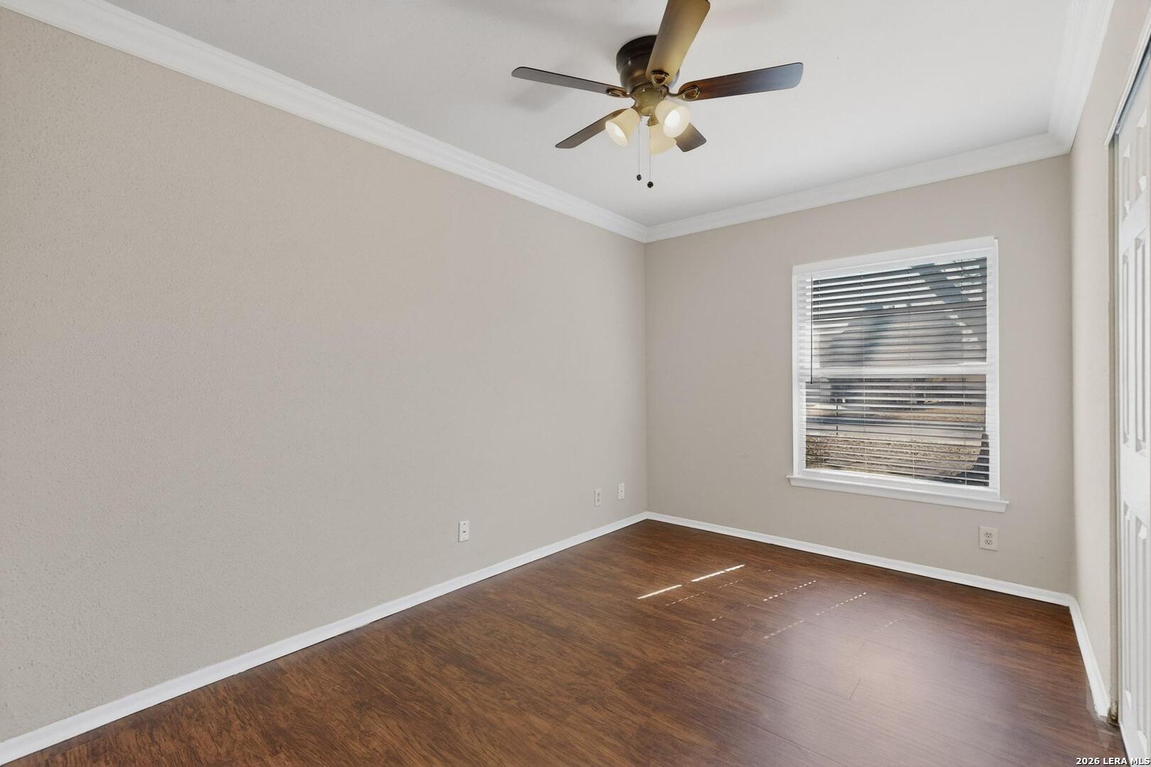 7219 Spring Drops Street San Antonio, TX 78249 - Photo 23 of 37 an empty room with a window and a fan