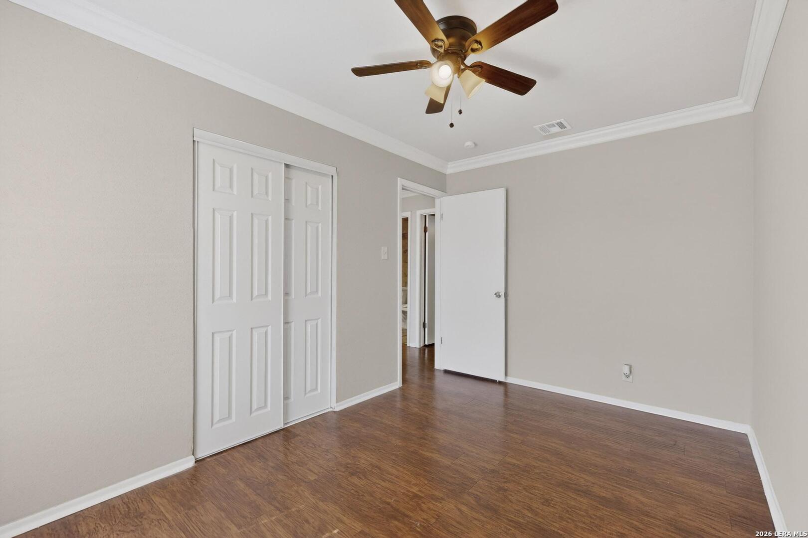 7219 Spring Drops Street San Antonio, TX 78249 - Photo 24 of 37 an empty room with wooden floor and a ceiling fan