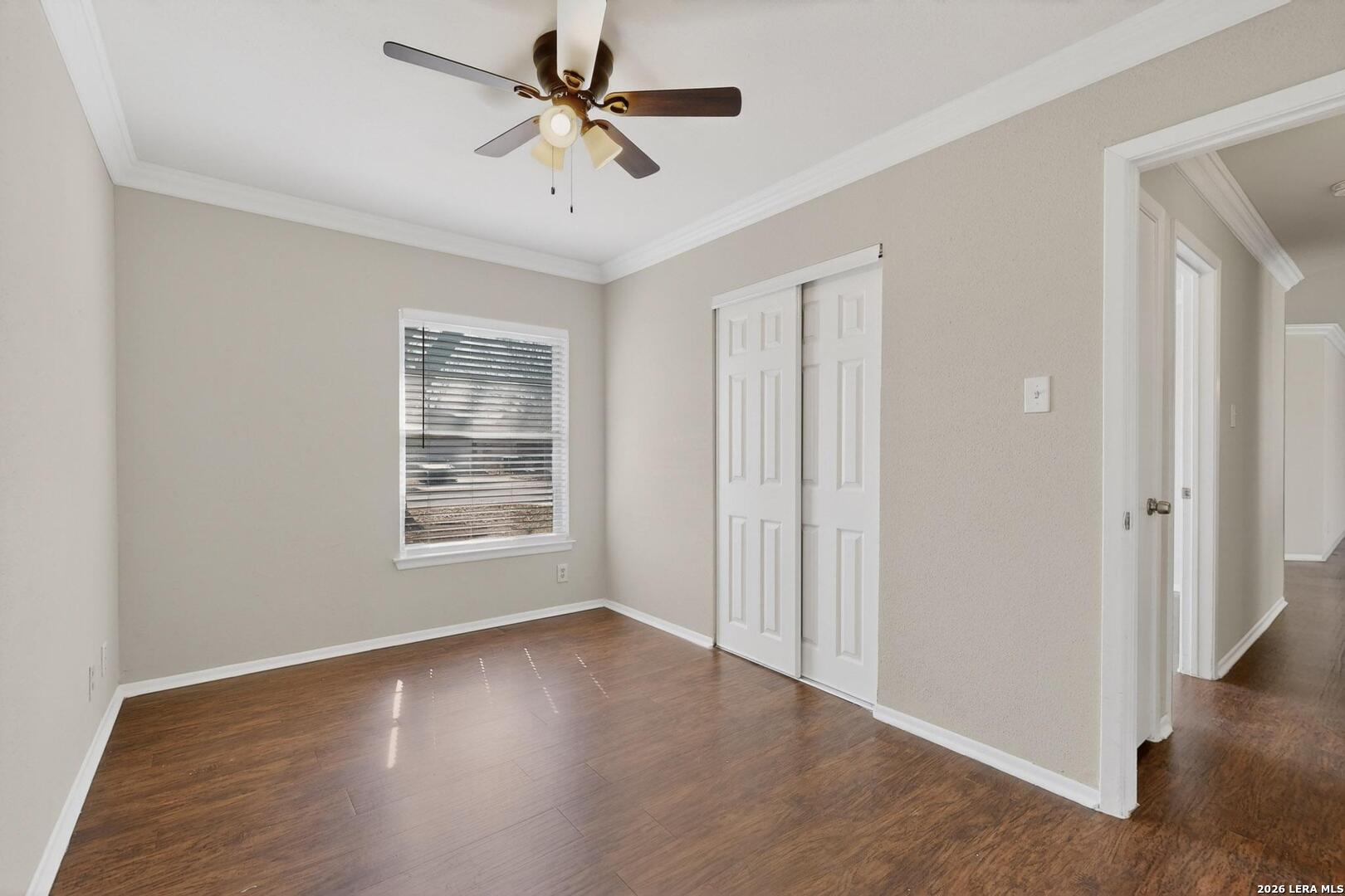 7219 Spring Drops Street San Antonio, TX 78249 - Photo 25 of 37 a view of a livingroom with a ceiling fan and wooden floor