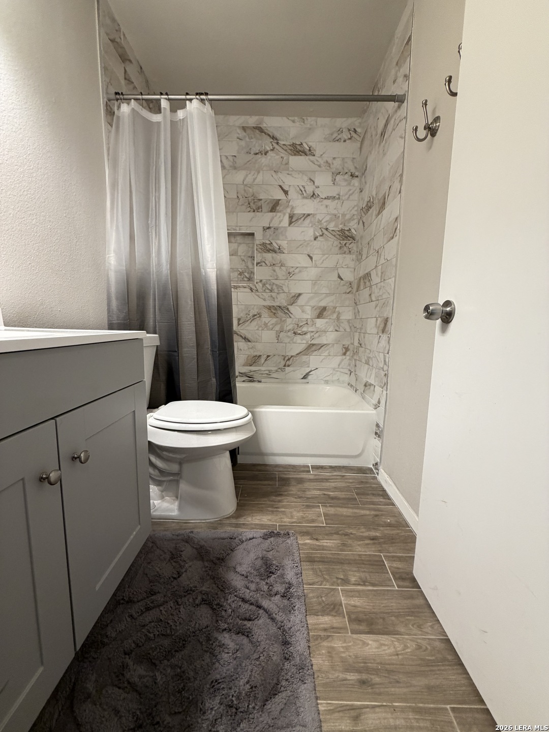 7219 Spring Drops Street San Antonio, TX 78249 - Photo 27 of 37 a bathroom with a toilet and a shower