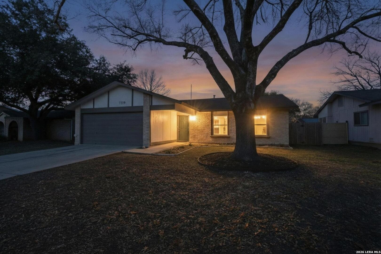 7219 Spring Drops Street San Antonio, TX 78249 - Photo 3 of 37 a view of a house with backyard and garden