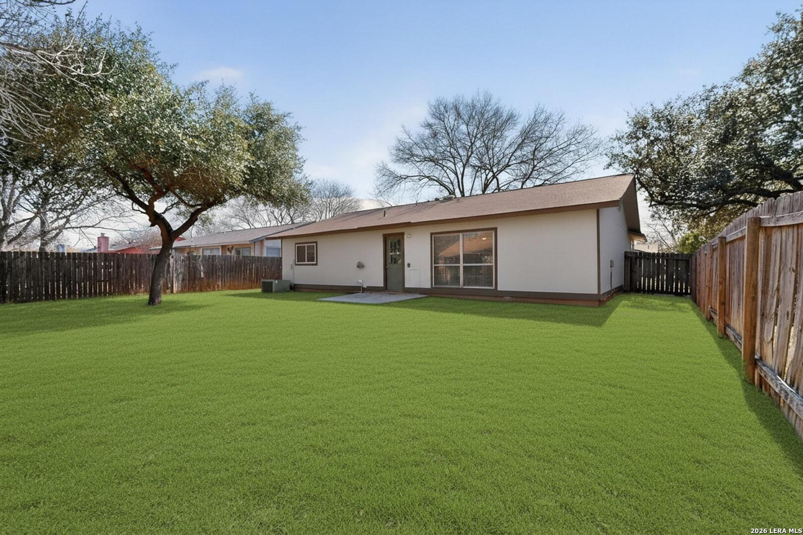 7219 Spring Drops Street San Antonio, TX 78249 - Photo 31 of 37 a front view of house with a garden