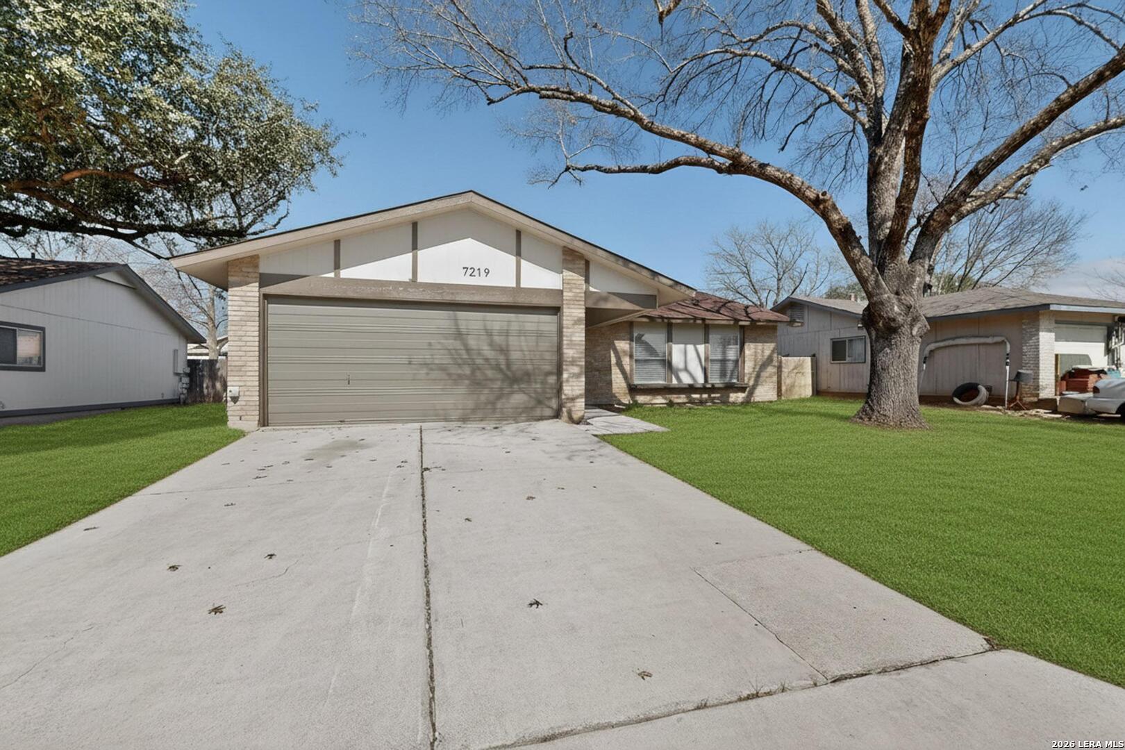 7219 Spring Drops Street San Antonio, TX 78249 - Photo 4 of 37 a front view of a house with a yard