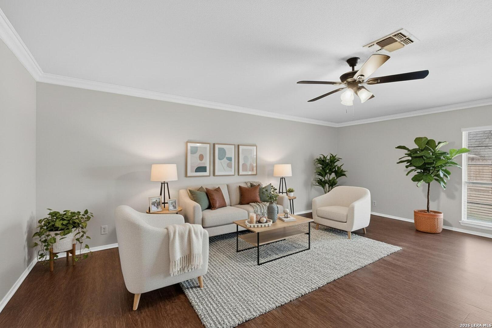 7219 Spring Drops Street San Antonio, TX 78249 - Photo 5 of 37 a living room with furniture potted plant and wooden floor