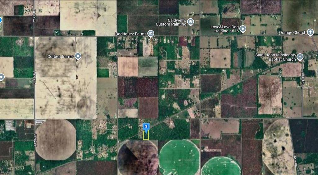 20565 Lancaster Road Live Oak, FL 32060 - Photo 2 of 5 an aerial view of residential houses with outdoor space