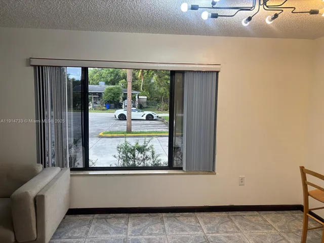a view of a living room and a window