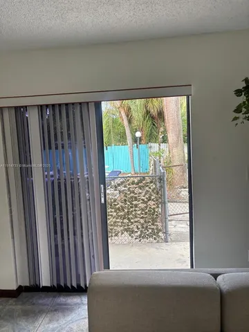 a view of a small space with a large window