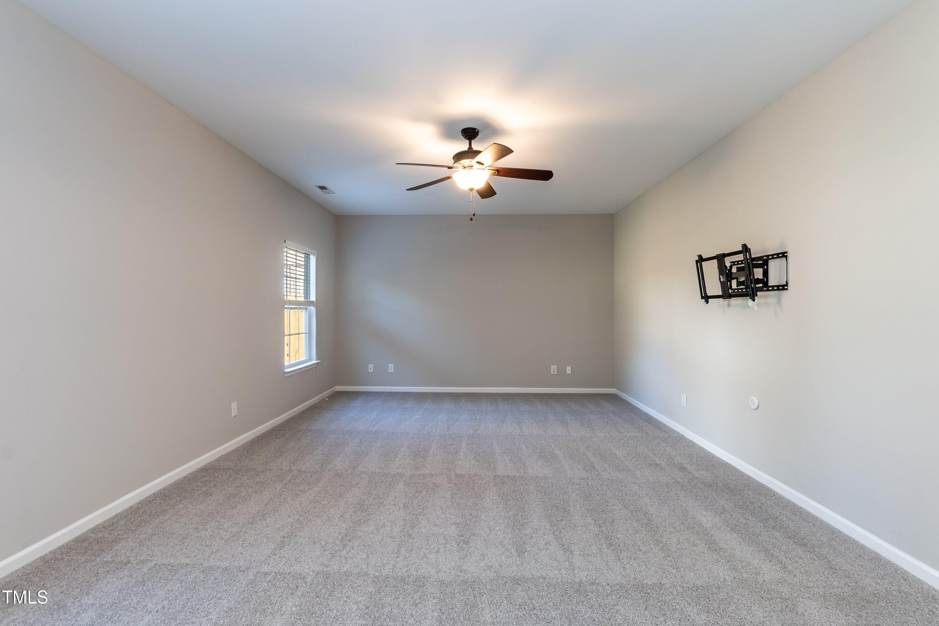 408 Cottesbrook Drive Wake Forest, NC 27587 - Photo 12 of 37 wooden floor in an empty room with a window
