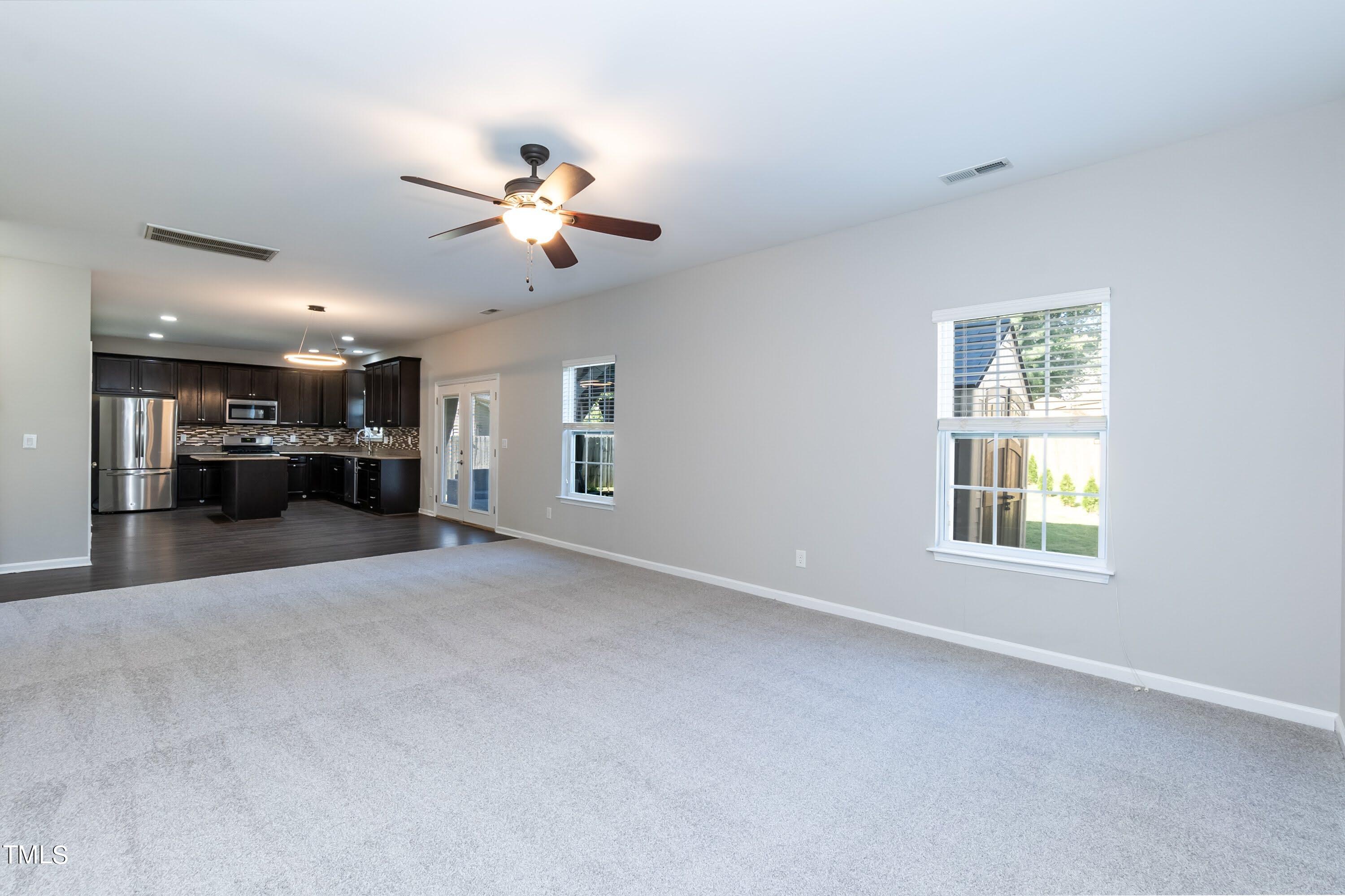 408 Cottesbrook Drive Wake Forest, NC 27587 - Photo 13 of 37 a view of a livingroom with a ceiling fan and window