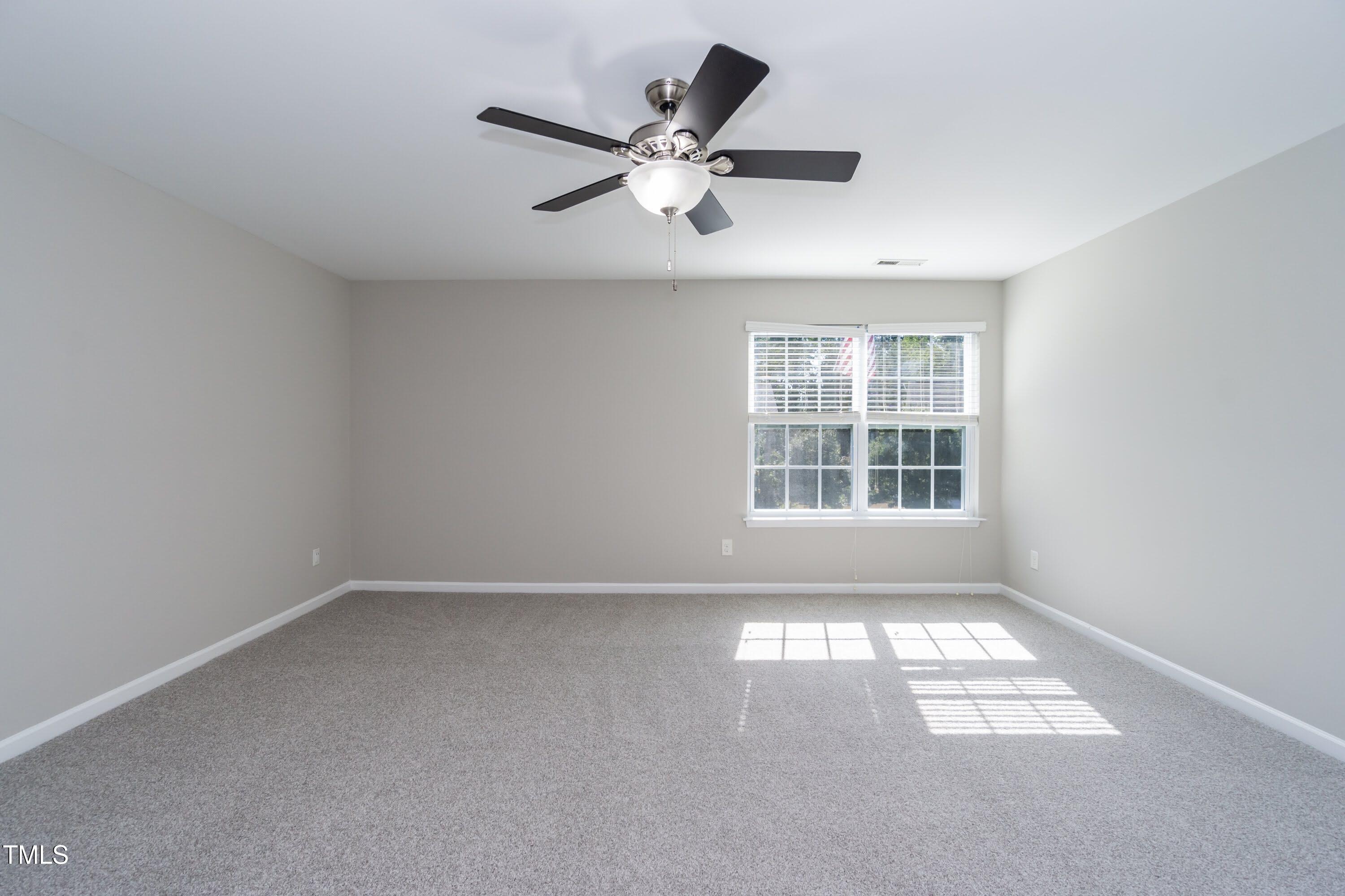 408 Cottesbrook Drive Wake Forest, NC 27587 - Photo 19 of 37 a view of an empty room with a window
