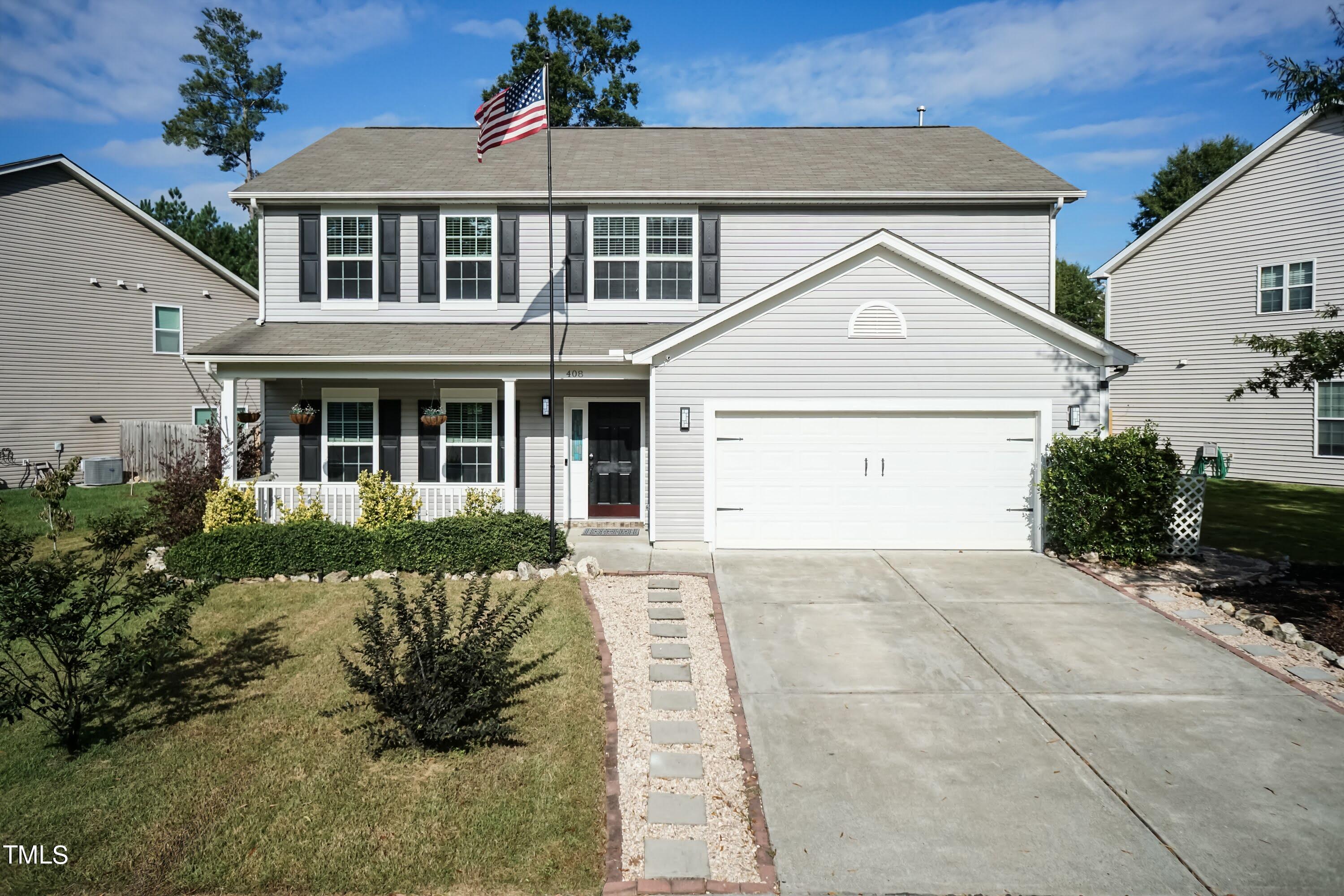 408 Cottesbrook Drive Wake Forest, NC 27587 - Photo 2 of 37 a front view of a house with a yard
