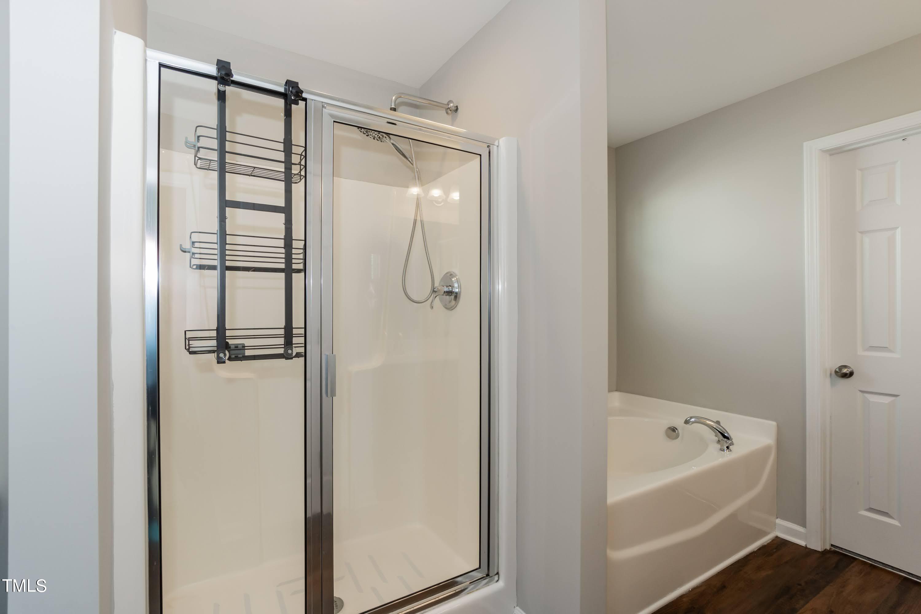408 Cottesbrook Drive Wake Forest, NC 27587 - Photo 22 of 37 a bathroom with a bathtub and a shower