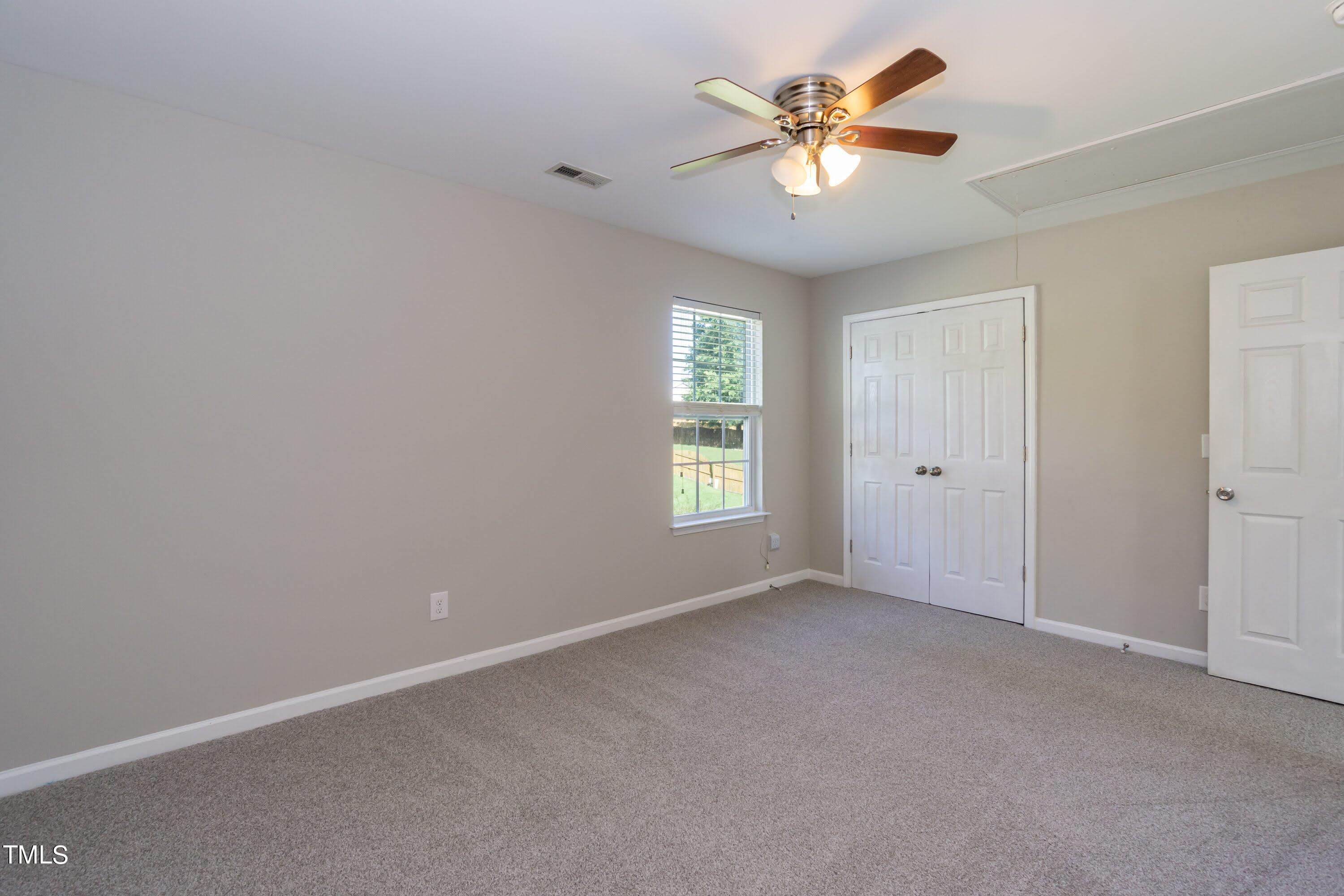 408 Cottesbrook Drive Wake Forest, NC 27587 - Photo 23 of 37 wooden floor in an empty room with a window