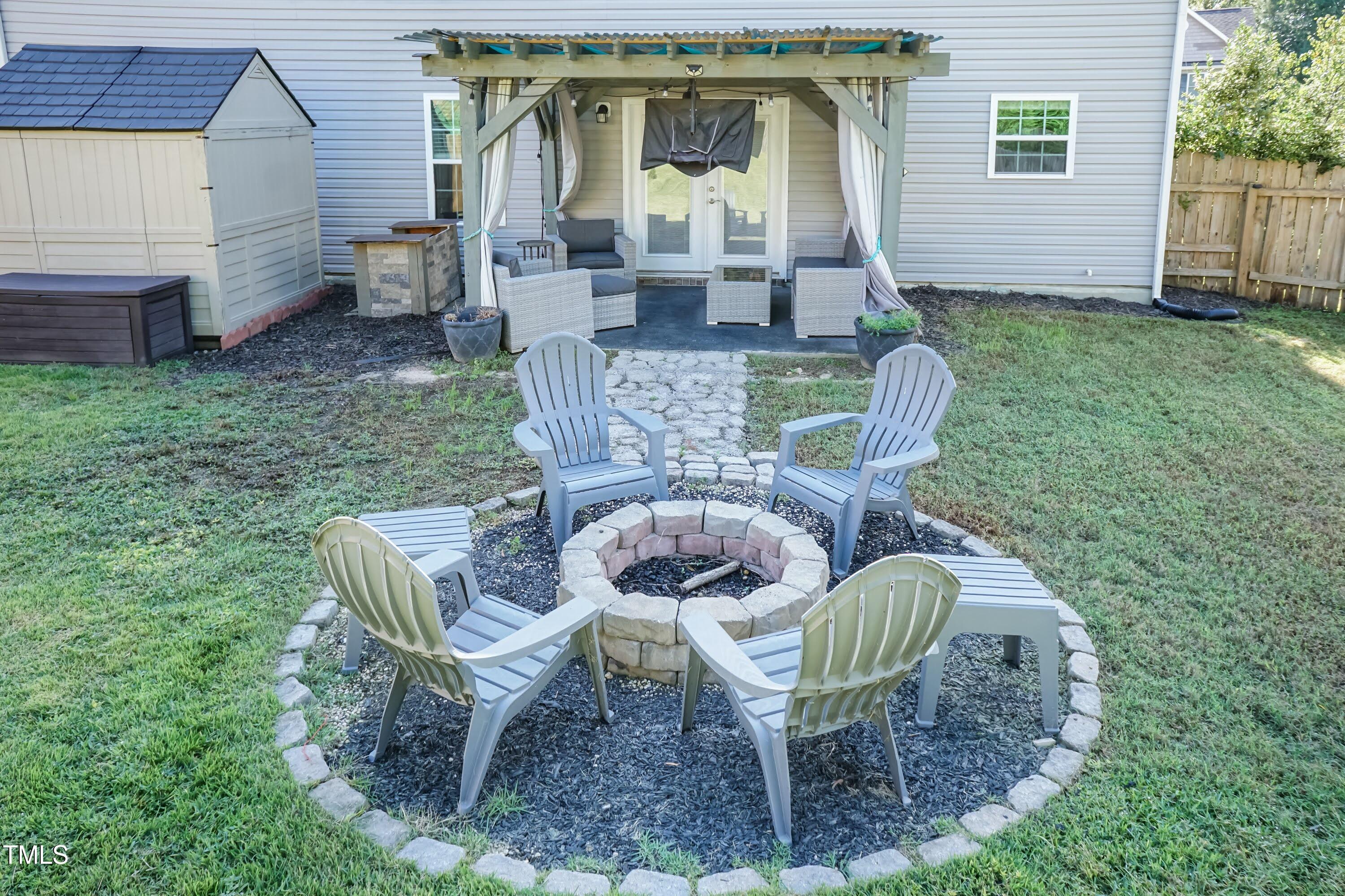408 Cottesbrook Drive Wake Forest, NC 27587 - Photo 30 of 37 a view of a chair and table in backyard of the house