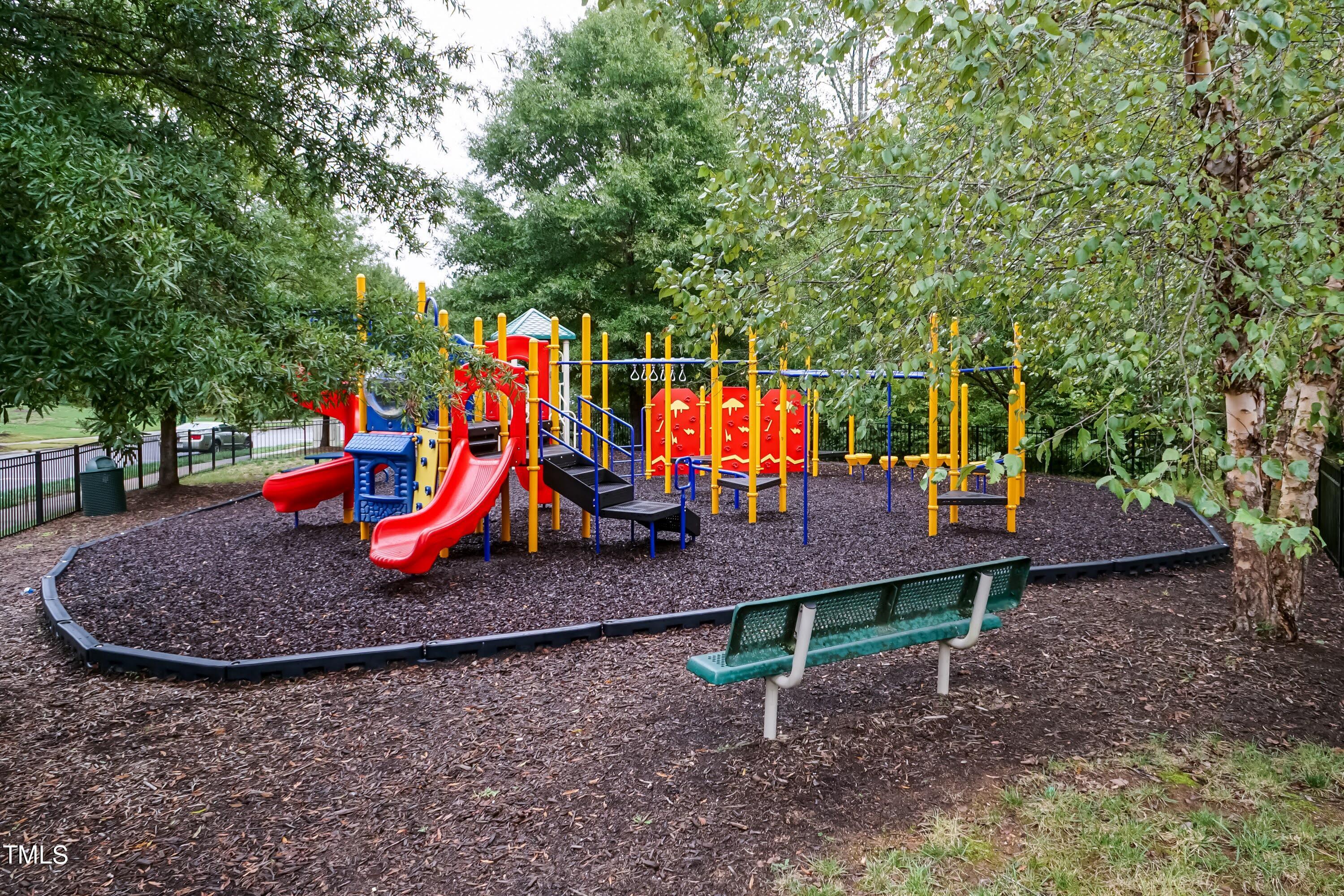 408 Cottesbrook Drive Wake Forest, NC 27587 - Photo 36 of 37 a wooden bench sitting in the middle of a park