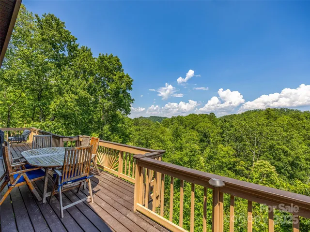 a view of a balcony with wooden floor