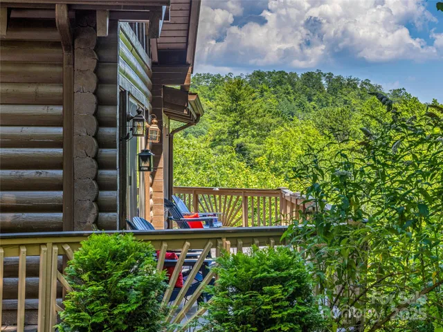 a view of sign board with buildings in the background