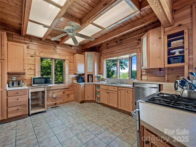 a kitchen with sink stove and cabinets