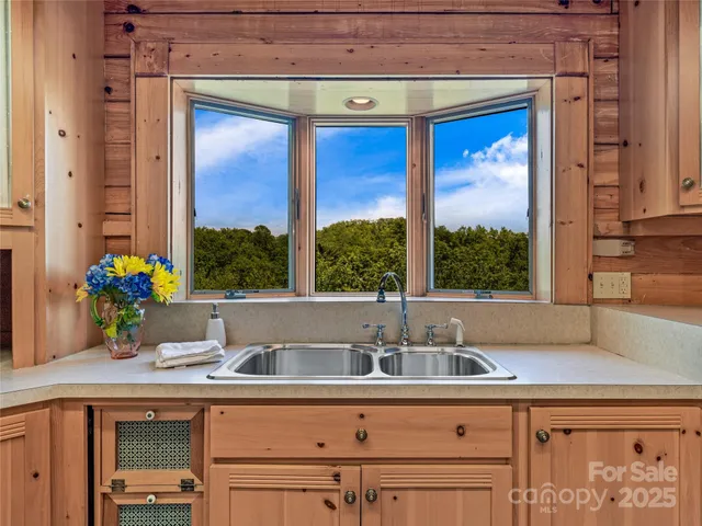 a kitchen with a sink and a window