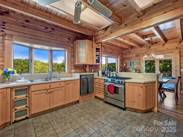 a kitchen with stove and white cabinets