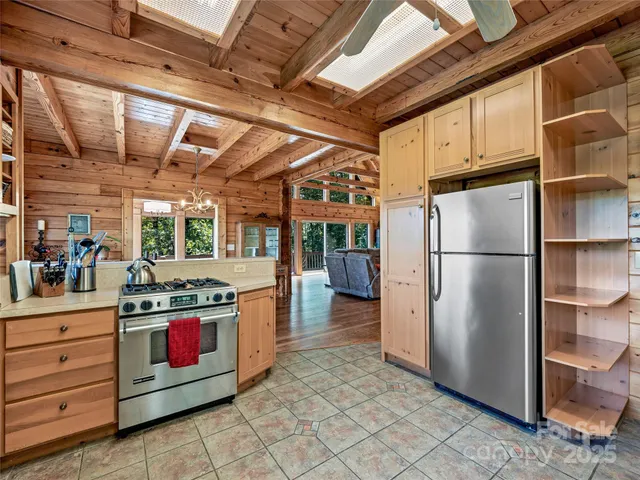 a kitchen with stainless steel appliances granite countertop a stove and a refrigerator