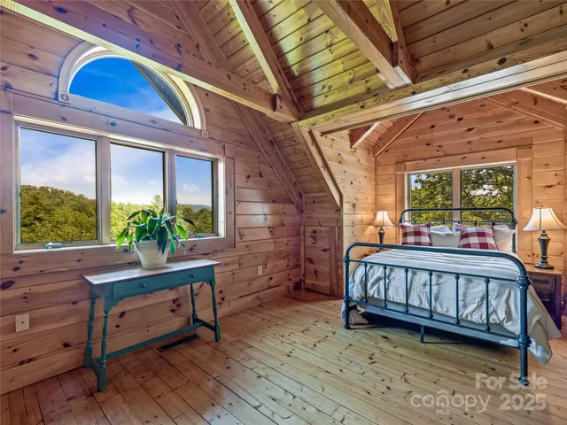 a view of a room with furniture and a window