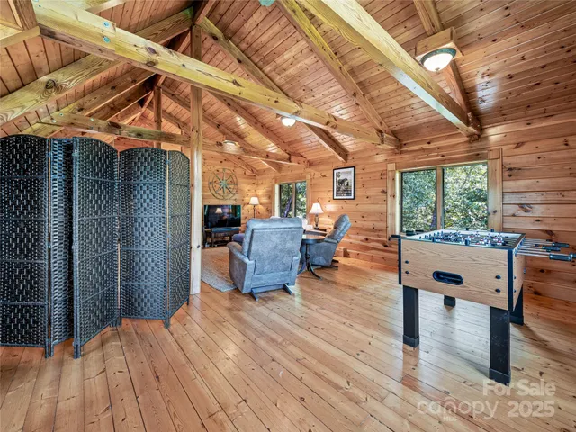 a outdoor space with the couches and dining table with the balcony view