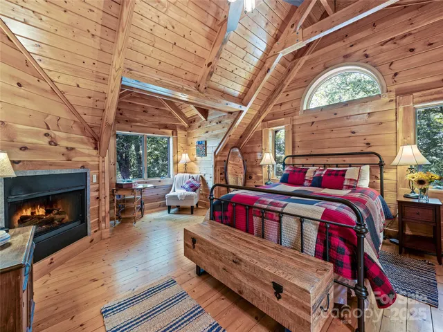 a bedroom with furniture and a fireplace