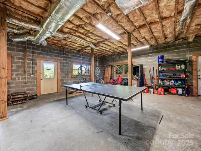a view of a room with lots of furniture and a garage
