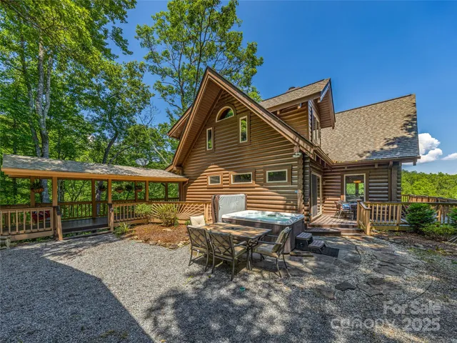 a backyard of a house with yard and outdoor seating