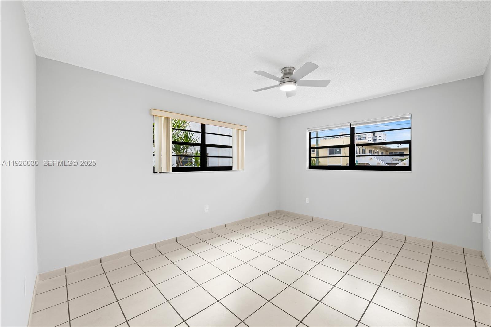 7915 Harding Avenue, Unit 1 Miami Beach, FL 33141 - Photo 13 of 25 a view of an empty room with window