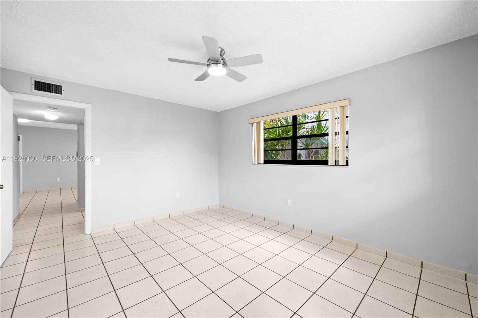 7915 Harding Avenue, Unit 1 Miami Beach, FL 33141 - Photo 15 of 25 a view of an empty room and window