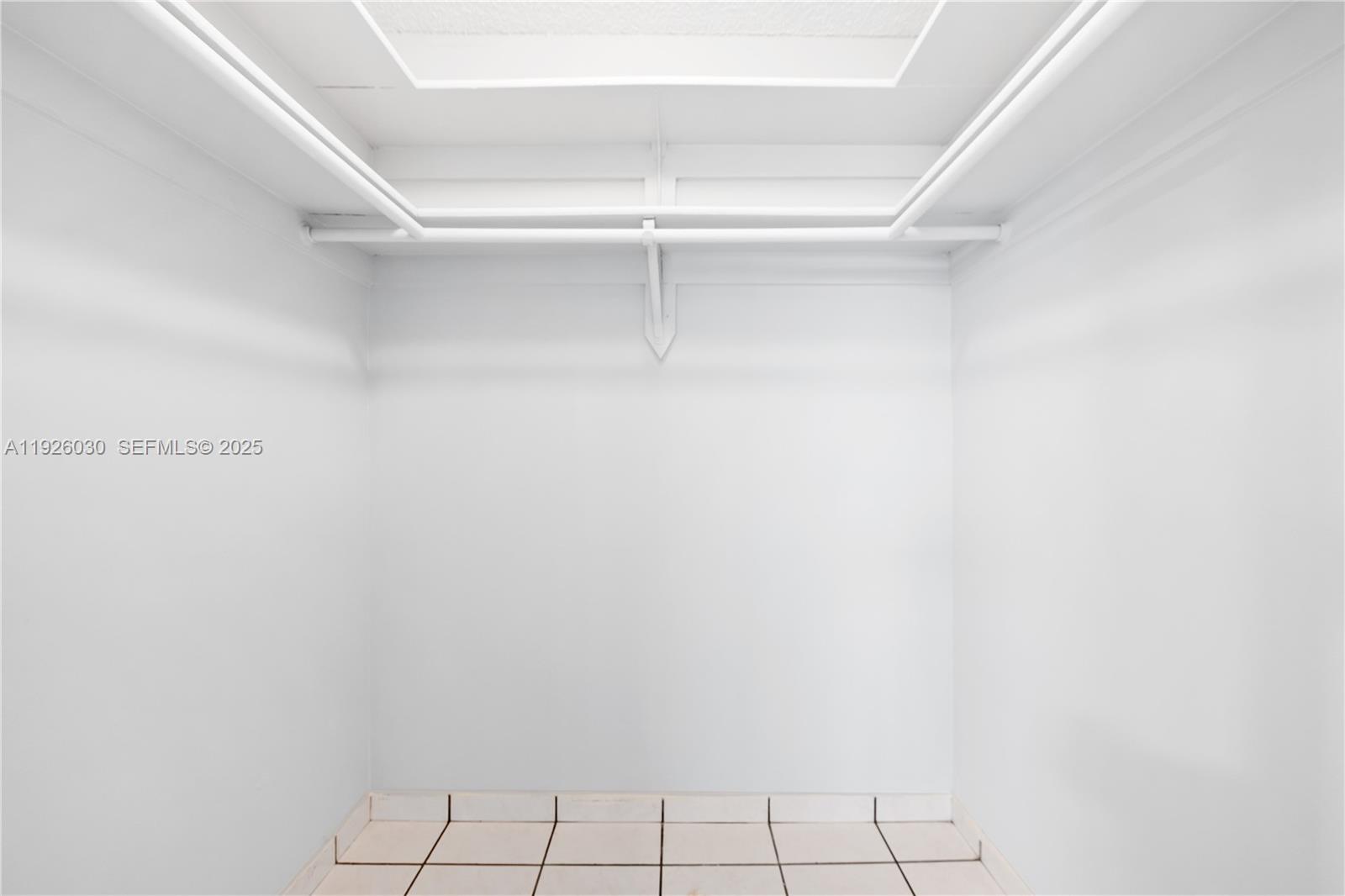 7915 Harding Avenue, Unit 1 Miami Beach, FL 33141 - Photo 16 of 25 a view of a room with racks on the wall