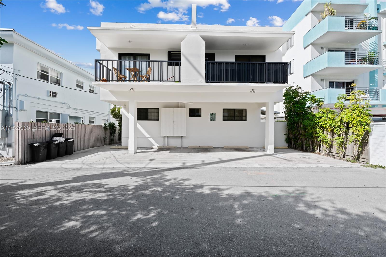 7915 Harding Avenue, Unit 1 Miami Beach, FL 33141 - Photo 19 of 25 a view of a building with car parked