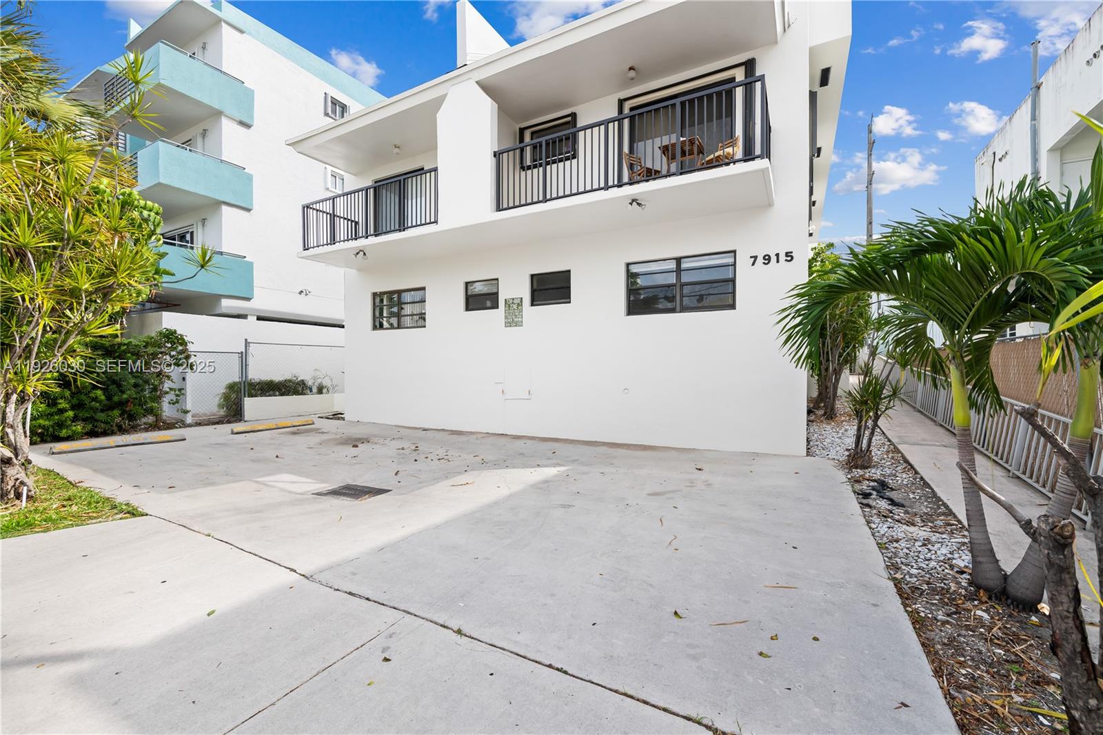 7915 Harding Avenue, Unit 1 Miami Beach, FL 33141 - Photo 20 of 25 a view of a house with a yard